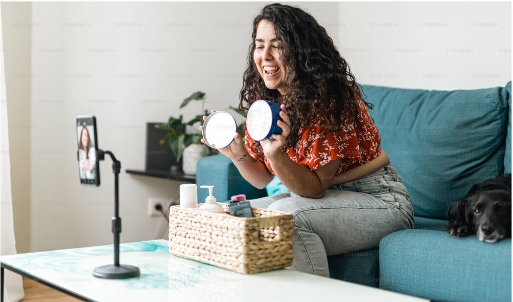 a niche influencer showcases products from a basket in front of a camera